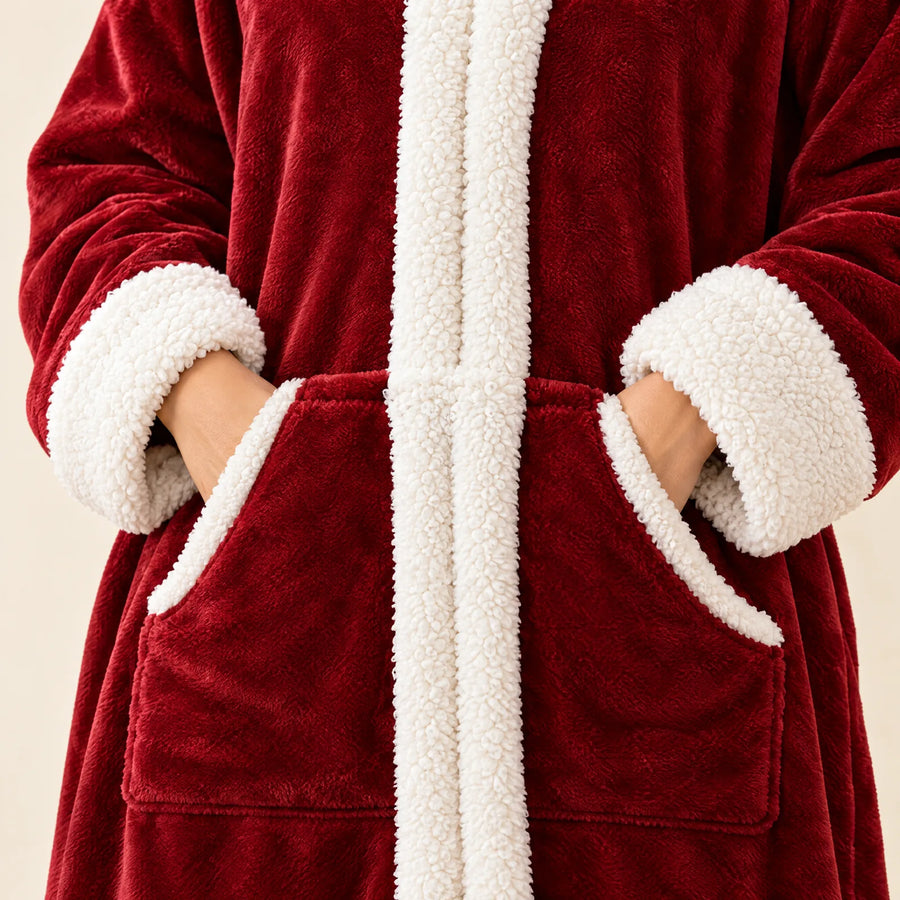 Large front kangaroo pocket and white sherpa cuffs on the burgundy blanket
